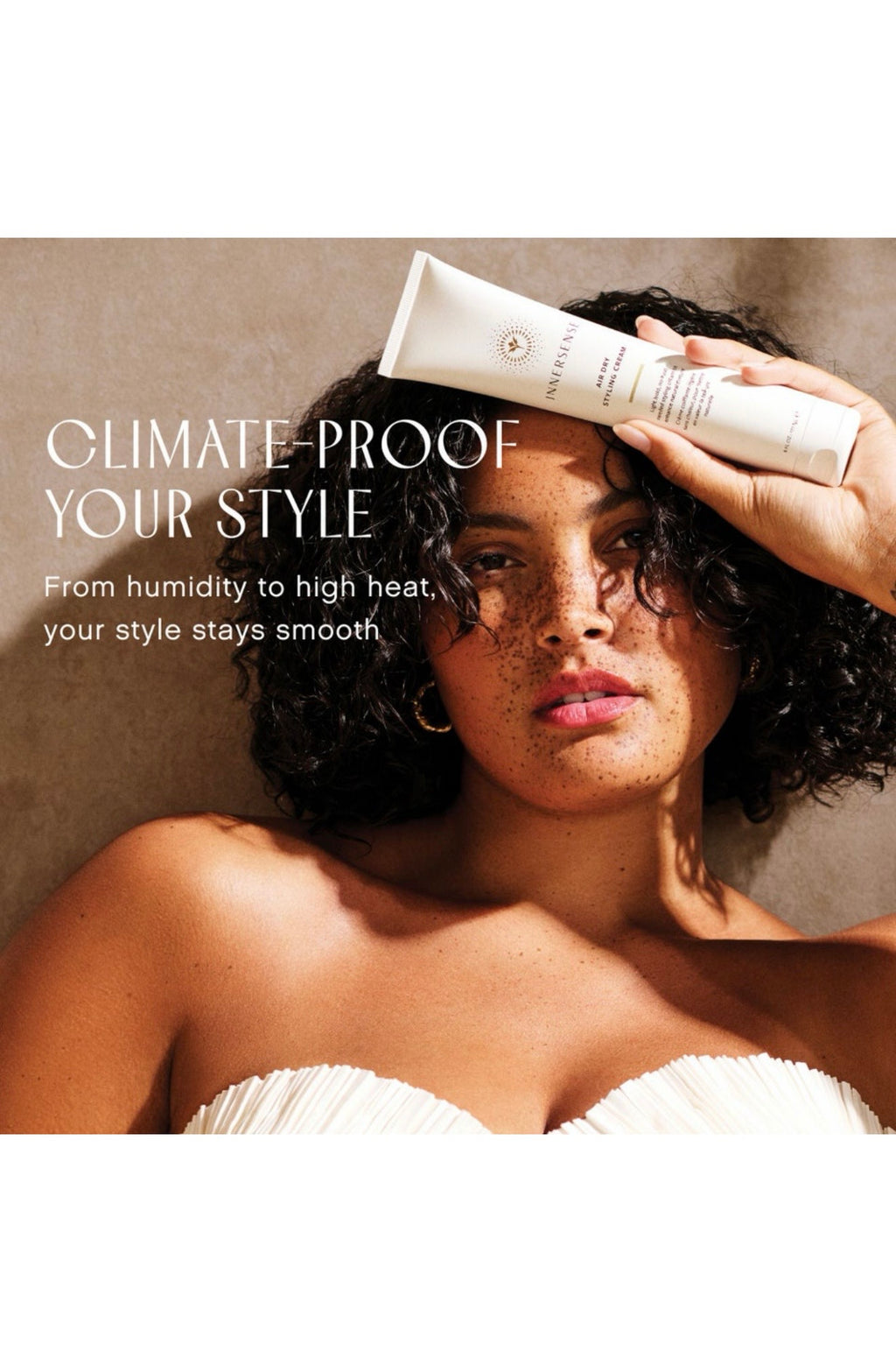 Woman applying hair product with text 'Climate-proof your style' on a beige background