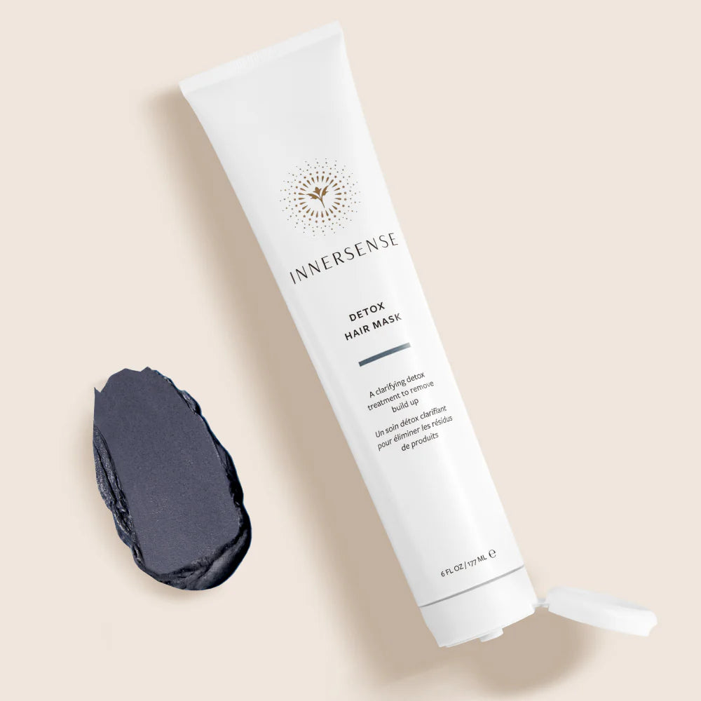 Tube of Innersense detox hair mask with some of the grey product next to it. 