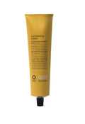 Yellow tube of Oway curl priming cream on a white background