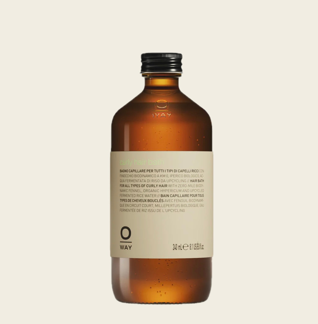Oway Brown Curly Hairbath bottle with a label on a beige background